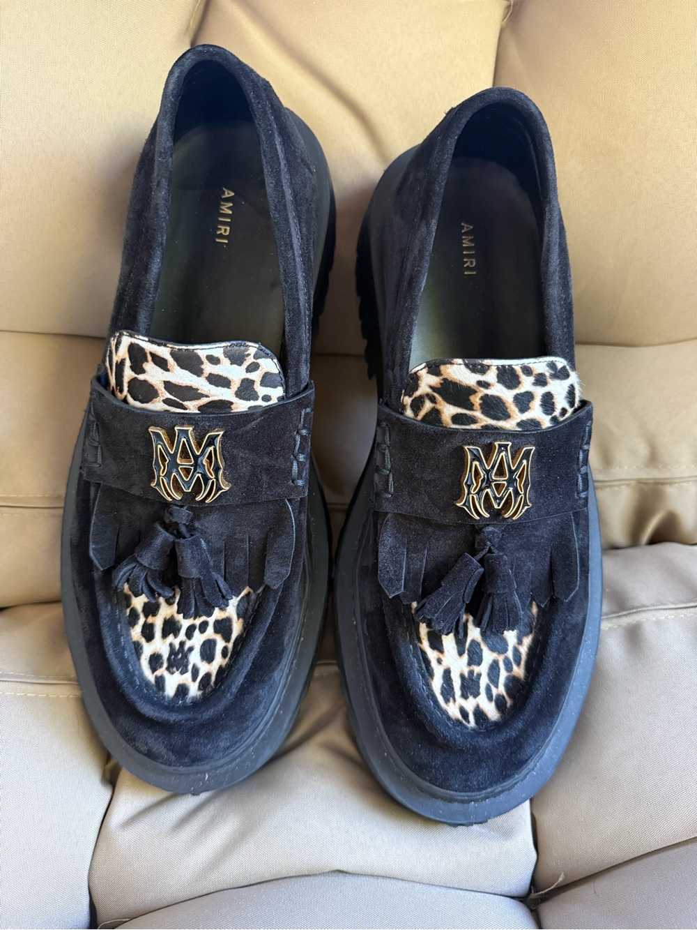 AMIRI Black Suede Tassel Loafers with Leopard Accent and Gold Crest